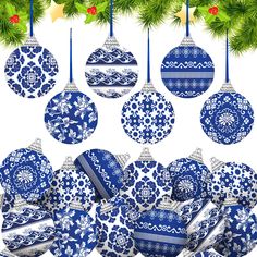 blue and white ornaments hanging from a christmas tree