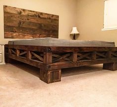 a bed frame made out of wooden planks in a room with beige carpeting