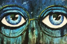 an image of two blue eyes painted on the side of a wall