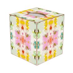 a square box with an abstract design on the front and sides, in multicolored colors