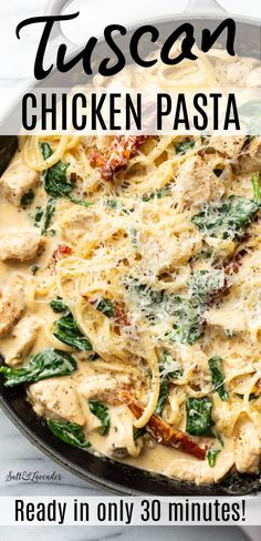 a skillet filled with chicken pasta and spinach