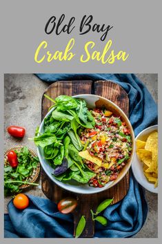 a bowl filled with salad next to tortilla chips