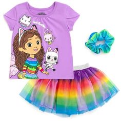 Join Gabby and her best stuffed animal pal Pandy Paws on their dollhouse adventures in this Gabbys Dollhouse Short Sleeve T-Shirt & Skirt & Scrunchie. Make crafts, bake, garden, and learn with all the adorable Gabby Cats: Cakey, Kitty Fairy, Pillow Cat, Baby Box, DJ Catnip, MerCat, CatRat, and Carlita. Your little girl is dressed for fun and play in this 3 piece mix n match clothing set: short sleeve graphic tee shirt, skirt, and elastic hair scrunchie. Size: 5T.  Color: Multicolor.  Gender: fem Gabbys Dollhouse Clothes, Gabby Party, Dj Catnip, Pandy Paws, Kitty Fairy, Dollhouse Dresses, Purple Rainbow, Cat Baby, Baby Box