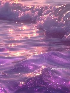 the water is purple and has small bubbles on it, as well as stars in the sky