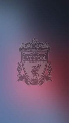 the liverpool football club logo on a blurry background