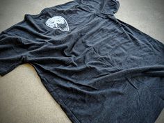 "This is a t-shirt of my piece, \"Spirit Board\" on a high quality, heather black, athletic fit tee. The back has the planchette print." Ouija Boy Fashion, Ouija Fashion, Cute Ouija Board, Ouija Tshirt, Unique Ouija Boards, Spirit Board, Ouija Board, Athletic Fits, Heather Black