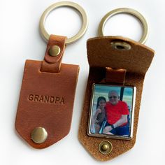 two leather keychains with a photo on them