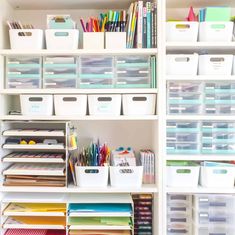 the shelves are filled with many different types of paper and office supplies in bins