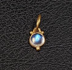 1. 14k Gold Rainbow Moonstone Pendant 2. Made to Order 3. Jewelry Type - Pendant 4. Total Weight - 0.275 Gram Approx.  5. Moonstone Weight - 0.32 Carat 6. Gold Weight - 0.211 Grams 7. Gold Purity - 14k 8. Jump Ring Outer Size - 6 MM 9. Moonstone Size - 4 MM 10. Ready to Dispatch in 1 - 2 days. 11. Handmade Items 12. AAA Quality Charms Pendant  13. 2 Quantity Available  14. Cabochon  Pictures are taken under natural and day light. Gold Moonstone Round Jewelry, Gold Moonstone Round Stone Jewelry, Gold Moonstone Jewelry With Round Stone, Gold Moonstone Jewelry With Bezel Setting, Dainty Moonstone Jewelry With Cabochon, Tiny Charm, Rainbow Moonstone Pendant, Moonstone Pendant, Bezel Setting