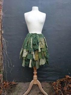 Upcycled Skirt Woman's Clothing   Shades of green, a lot of ruffles made of shredded hand dyed lace, cotton, linen and jersey.  Raw edges are part of the hippie design:)  Messy and romantic:)   Ready to ship. Stripe will help you to fit the skirt according to your size.       Size Small/Medium /Large/XLarge Measurements: waist/hips up to 49inch(125cm) length 23(58cm) Are you looking for a different size or colours?                                                                                   I will be more than happy to design something just for you. :) Tattered Fairy Skirt, Tattered Skirt, Faire Outfit, Upcycled Skirt, Fairy Gown, Pixie Skirt, Dragons Clothes, Hippie Designs, Fairy Skirt