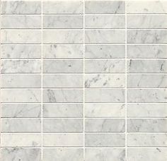 a white marble mosaic tile wall