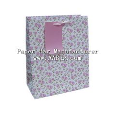 a paper bag with pink flowers on it