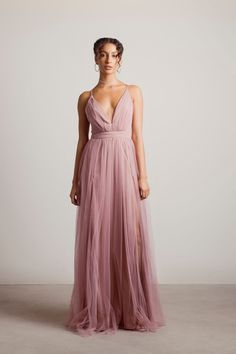 a woman in a long pink dress