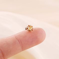 Metal: 14k solid gold, Not Plated or Gold Filled Available Gold color: Yellow gold  Stone: Citrine, Yellow Hair Quartz  Thickness: 0.82mm (20G) , 1.0mm (18G), 1.2mm (16G) Stamp: 14k on top or 14k gold back, no stamp on titanium back, ★Sold as single piece ★Threadless Push Pin (Flat Back) ★ We have two different materials of Push back for you choose: ● One is 14k solid gold with length : 6mm(standard), 8mm, 10mm (long)  ● Another is implanted grade titanium push back in size 5mm(short) 6mm 8mm an Dainty Gold Cartilage Earring, Dainty Gold Single Cartilage Earring, Gold Single Cartilage Earring As Gift, Gold Cartilage Single Earring As A Gift, Gold-plated Piercings As Gift, Gold Single Earring Cartilage Earrings As Gift, Yellow Gold Plated Flower-shaped Jewelry, Dainty Gold Piercings With Birthstone, Dainty Yellow Flower Shaped Jewelry