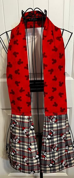 a red scarf with mickey mouses on it