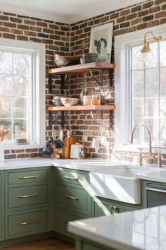 A charming kitchen featuring green cabinets and a warm brick backsplash, complemented by open wooden shelves and large windows. Brick Wall Kitchen Ideas, Brick Backsplash Ideas, Kitchen With No Upper Cabinets, Kitchen With Green Cabinets, Green Kitchen Inspiration, Brick Tile Backsplash, Backsplash Kitchen Ideas, Brick Wall Kitchen, Rustic Kitchen Backsplash