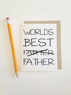 a card with the words world's best father written on it next to a pencil