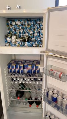 an open refrigerator filled with lots of drinks