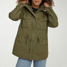 Stay stylish and comfortable with levi's women's cotton hooded military jacket. Featuring an adjustable waistband and hood, this jacket will keep you warm all while fitting you seamlessly. Crafted with four spacious pockets and a snap and full zipper closure, this wind resistant jacket is perfect for braving the elements in style.Features: Wind ResistantClosure Type: Snap & ZipperFit: Regular FitPockets: 2 Chest Snap Pockets, 2 Front Snap PocketsSleeve Length: Long SleeveWarmth Factor: Lightweig Army Green Jacket, Adjustable Waistband, Levis Women, Fall Jackets, Field Jacket, Utility Jacket, Green Jacket, Leather Fashion, Military Jacket