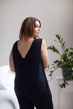 Our nursing-friendly jumpsuit is our must have style of the season. Made with a hidden snap placket that allows for easy access for nursing babe, this cozy jumpsuit also looks cute with a bump. Back 'V' detail and side pockets for stashing stray binkies and midnight snacks. NOM is designed and built to last during, for nursing + after. FREE shipping and returns CARE & DETAILS Fits true to size.Made of 95% Rayon from Bamboo, 5% Spandex.Machine wash and lay flat to dry.52" from shoulder to hem.Des Maternity Jumpsuit, Nursing Friendly, After Pregnancy, Maternity Nursing, Nursing Bra, Everyday Dresses, Black Jumpsuit, Maternity Clothes, Bump