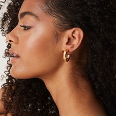 If there is one trend that you NEED to jump on the bandwagon for, it’s chunky hoops earrings. These hoops are so perfectly thick, beautiful, and everything you need in a hoop earring. Pop these on with absolutely anything and completely transform your look. Materials 925 Sterling Silver post 14K yellow, rose or white gold plated Measurements: Diameter: 30mm (1.18”) ; Width: 6.5mm (.25”) Hypoallergenic; nickel, lead, and cadmium free