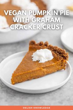 a slice of vegan pumpkin pie with graham cracker crust on a white plate