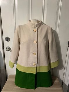 Elegant vintage coat from the 80-90s Authentic vintage garment in great used condition, no flaws. No size but measurements are in photos, fits like a M/L Message me if you have any questions. Vintage Stand Collar Winter Blazer, Vintage Fitted Khaki Outerwear, Fitted Khaki Vintage Outerwear, Fitted Vintage Khaki Outerwear, Retro White Outerwear With Buttons, White Retro Outerwear With Buttons, Vintage Single-breasted Outerwear With Stand Collar, Long Sleeve Outerwear With Button Closure In Vintage Style, Vintage Khaki Blazer For Fall