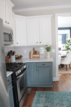 the kitchen is clean and ready for us to use it's new stove top