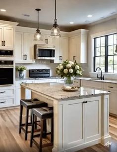 a large kitchen with an island and two stools