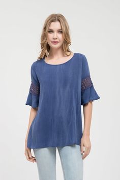 Round neck indigo top with lace sleeves 95% Rayon, 5% Spandex Casual Stretch Lace Top With Lace Sleeves, Casual Stretch Blouse With Lace Patchwork, Blue Lace Patchwork Top For Spring, Stretch Lace Patchwork Short Sleeve Tops, Stretch Short Sleeve Tops With Lace Patchwork, Casual Stretch Lace Top With Lace Trim, Casual Blouse With Lace Sleeves And Stretch, Casual Stretch Blouse With Lace Sleeves, Casual Short Sleeve Blouse With Lace Sleeves