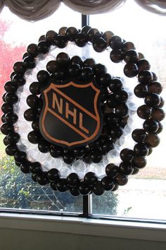 a wreath made out of glass beads with the logo of the hockey team on it