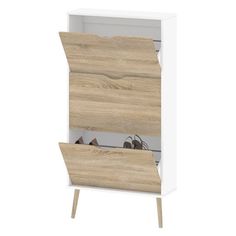 a white cabinet with wooden doors and two pairs of shoes on the bottom shelf in front of it