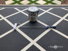 a paint can sitting on top of a black rug