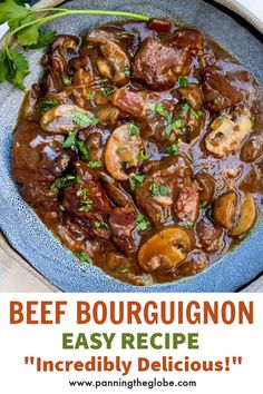 beef bourguignon recipe with mushrooms and parsley in a blue bowl