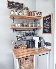 a small kitchen with shelves above the counter and coffee maker on the wall behind it