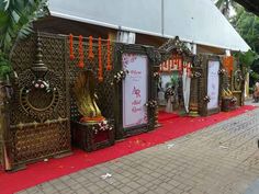 an outdoor ceremony with gold and red decorations