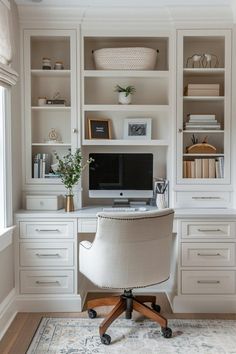 a home office with built - in shelving and desk