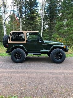 the jeep is parked on the side of the road