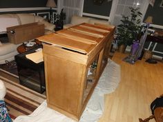 a living room filled with furniture and lots of clutter on top of the floor