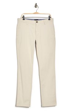 A solid hue makes these chino pants a versatile, everyday classic staple for your closet. 9" rise, 32" inseam (size 32x32) Trim fit Zip fly with button closure 2 front slash pockets; 2 back button welt pockets 97% cotton, 3% spandex Machine wash, tumble dry Imported Model stats: 6'1" height, 32" waist. Model is wearing size 32x32. Fitted Chino Cotton Twill Chinos For Spring, Classic Mid-rise Work Pants, Mid-rise Chinos For Business Casual In Spring, Classic Mid-rise Work Pants For Spring, Solid Color Slim Fit Straight Leg Chinos, Slim Fit Straight Leg Solid Chinos, Classic Slim Fit Mid-rise Chinos, Slim Fit Mid-rise Classic Chinos, Beige Slim Fit Straight Leg Chinos