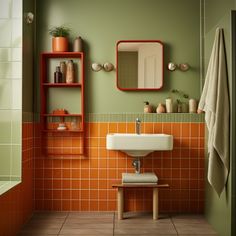 a bathroom with orange and green tiles on the walls, a white sink sitting under a mirror next to a wooden shelf