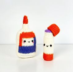 two crocheted bottles with faces on them, one is red white and the other is blue