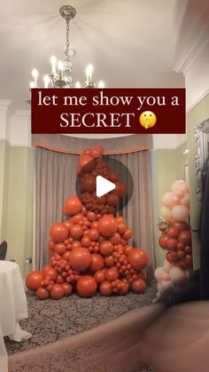 a man standing in front of a bunch of balloons with the words let me show you a secret