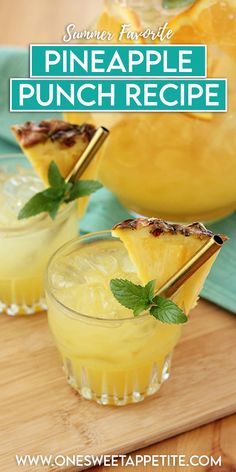 two glasses filled with pineapple punch and garnished with mint