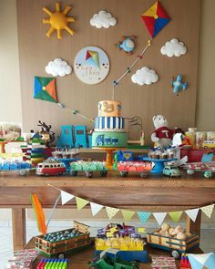 a birthday party with toys and decorations on the table