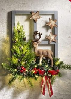 a christmas decoration with deer and pine cones