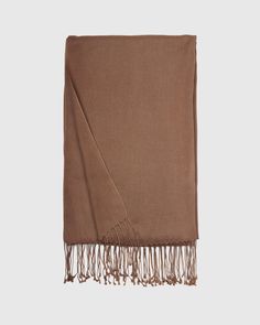 Our Cashmere Silk Scarf combines two of our favorite materials. This super soft, airy scarf has long fringe borders for a classic yet elegant look you'll love wearing around. Solid Color Fringe Scarf For Fall, Classic Fall Pashmina Shawl, Elegant Fringed Scarves For Fall, Classic Brown Shawl Scarves, Elegant Fringe Shawl Scarf, Elegant Fringed Shawl Scarf, Elegant Winter Shawl With Tassels, Elegant Tasseled Shawl For Winter, Classic Solid Color Pashmina Scarves