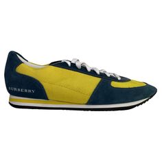 These Burberry runners feature University of Michigan colors blue and yellow. Perfect for Ann Arbor Students! They are made with yellow nylon and blue suede with contrasting white shoe laces. **Burberry shoes run small, so you may want 1/2 size larger. COLOR: Blue/yellow MATERIAL: Nylon/suede ITEM CODE: 3730114 SIZE: 39 EU / 8 US COMES WITH: Dust bags and shoe box CONDITION: The shoe boxes have marks, but the shoes are brand new. ------------------------------------------------------------------------------------------------------------- CARTEBLANCHESHOP.COM is an online boutique which also provides curation, consignment and customization services for authentic designer luxury items. CARTEBLANCHESHOP.COM is not an authorized brand dealer of Hermes, Chanel, Gucci, Saint Laurent or Dior nor Miu Miu Sandals, Sneakers Womens, Wooden Clogs, Burberry Shoes, University Of Michigan, Ann Arbor, Boutique Online, Blue And Yellow, Blue Suede