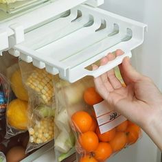 a person is grabbing food out of the refrigerator