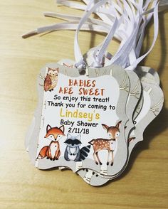 a baby shower tag with animals on it